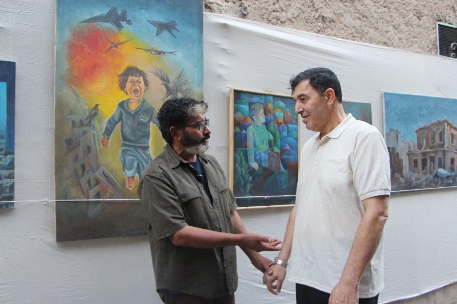 موسوعة المخيمات الفلسطينية تزور معرض: غزة يا جرحنا المفتوح، للفنان التشكيلي علي جروان ولمؤسسة كوشان، بعدسة لين محمد